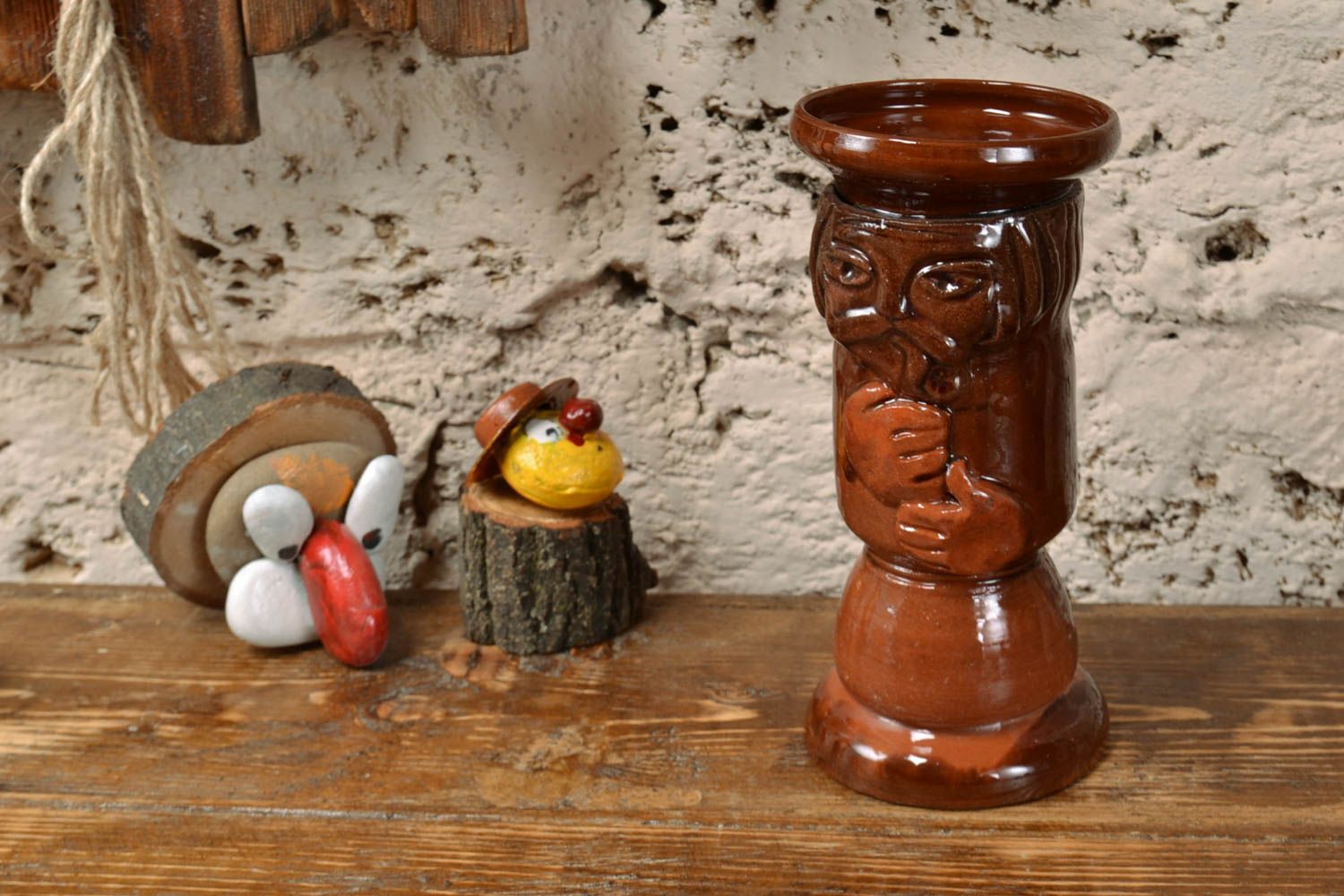 Beautiful handmade glazed ceramic candlestick in the shape of man photo 1
