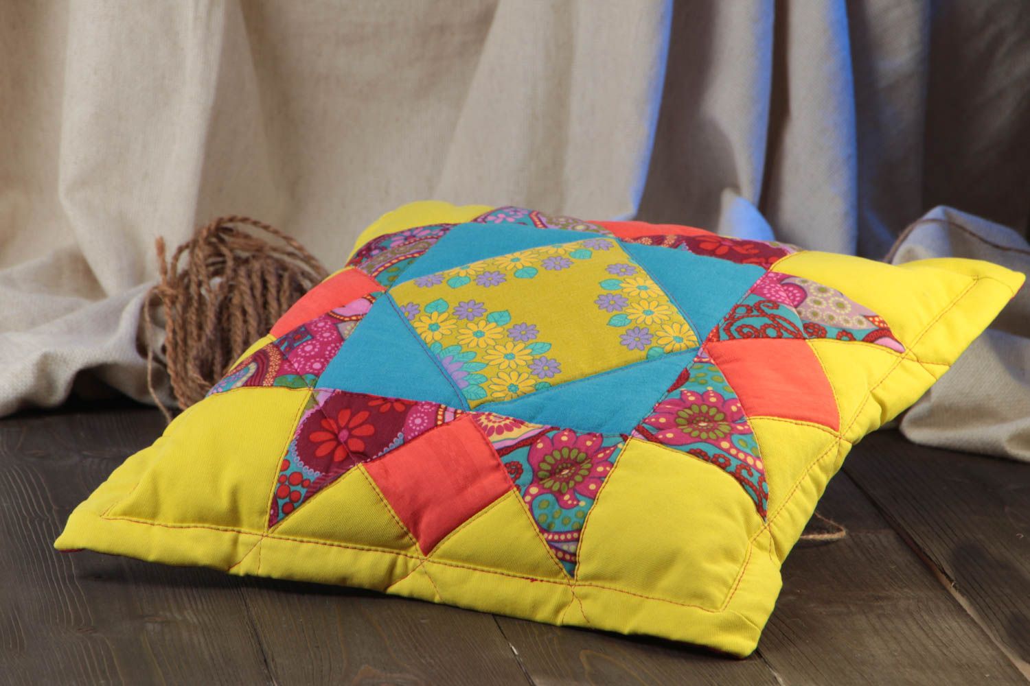 Colorful handmade cotton fabric patchwork cushion of yellow color photo 1