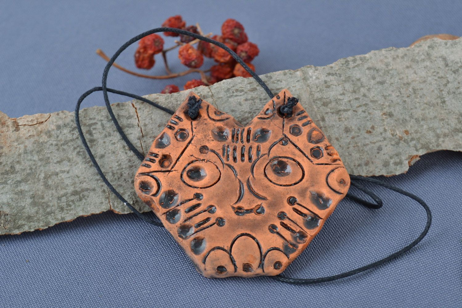 Handmade painted ceramic pendant of unusual shape on cord for women photo 1