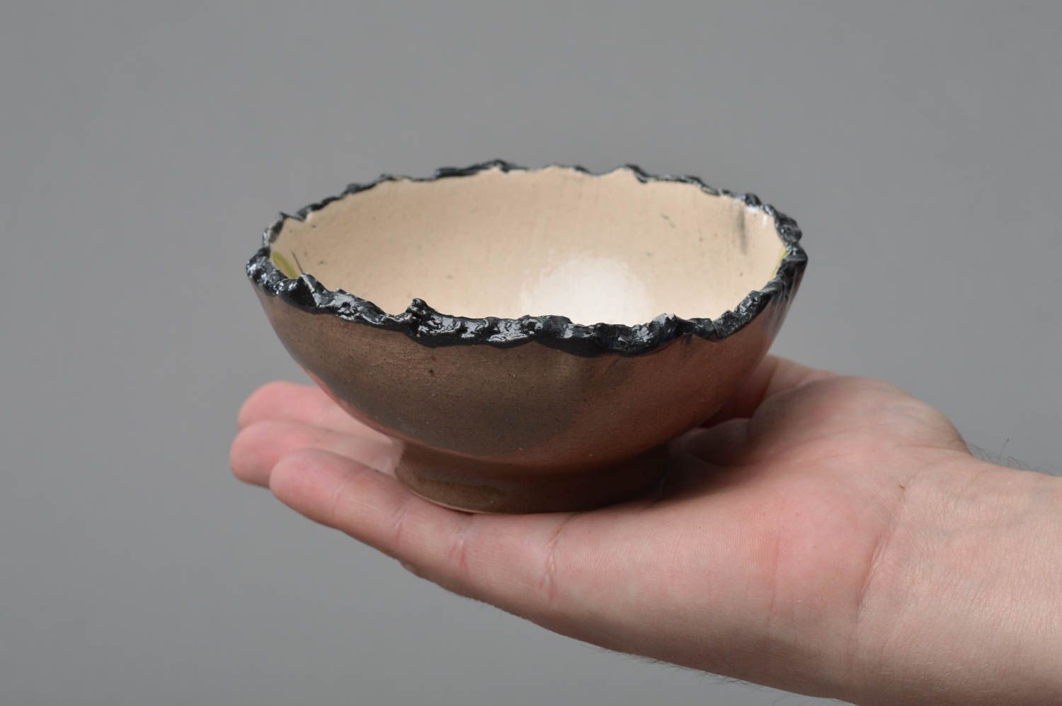Handmade small light porcelain glazed bowl with dark ragged edges photo 4