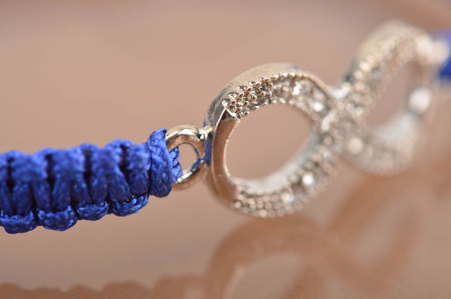 Handmade stylish thin blue woven wrist bracelet made of silk with insert photo 4