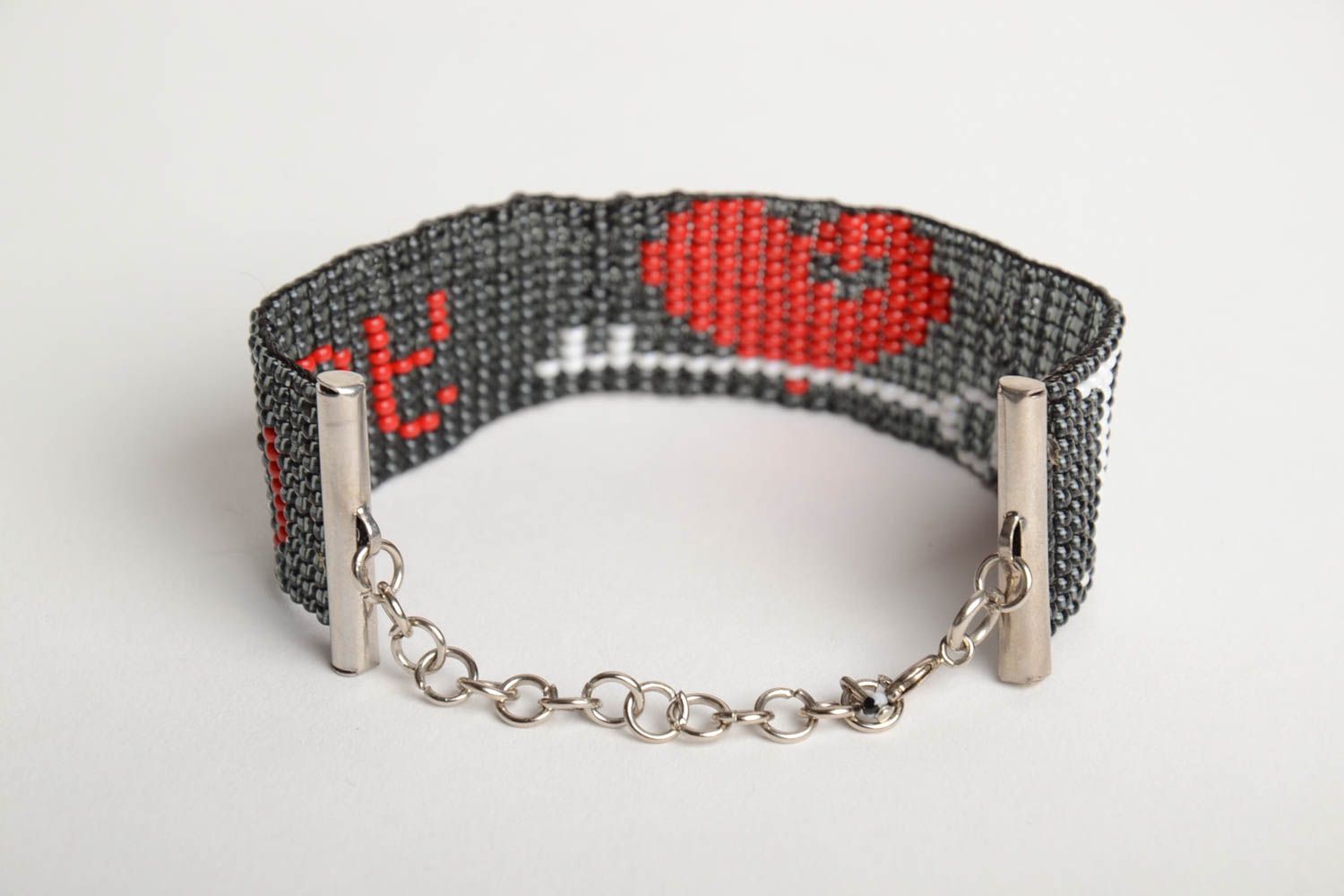 Handmade wide bead woven wrist bracelet with red heart on black background photo 3