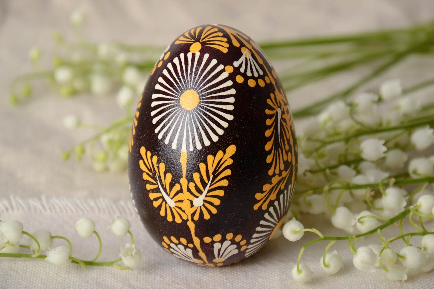 Handmade Lemkiv decorative Easter egg with bright flowers on black background photo 1