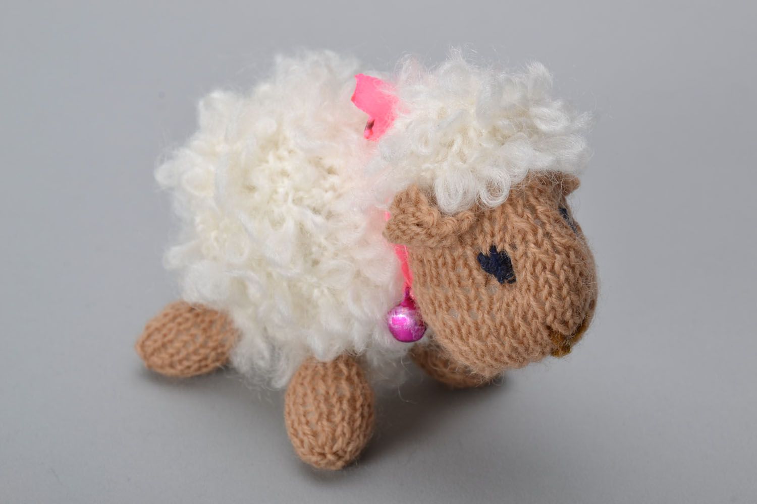 Knitted toy in the shape of a small sheep photo 2
