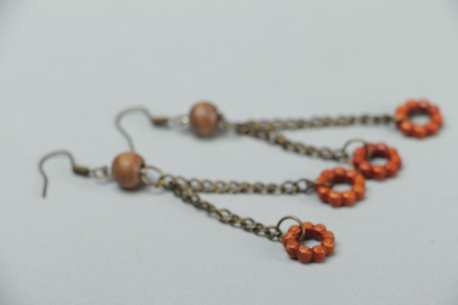 Handmade metal earrings with wooden beads photo 2