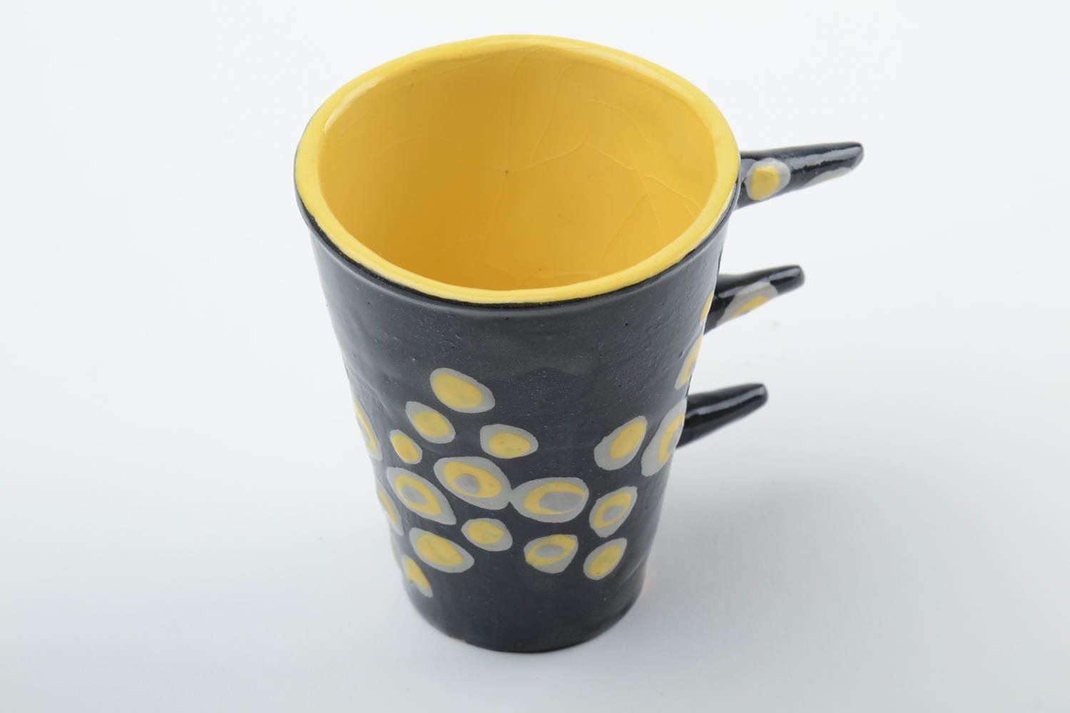 Ceramic art coffee 10 oz cup in black and yellow colors with unique three stick handle photo 2