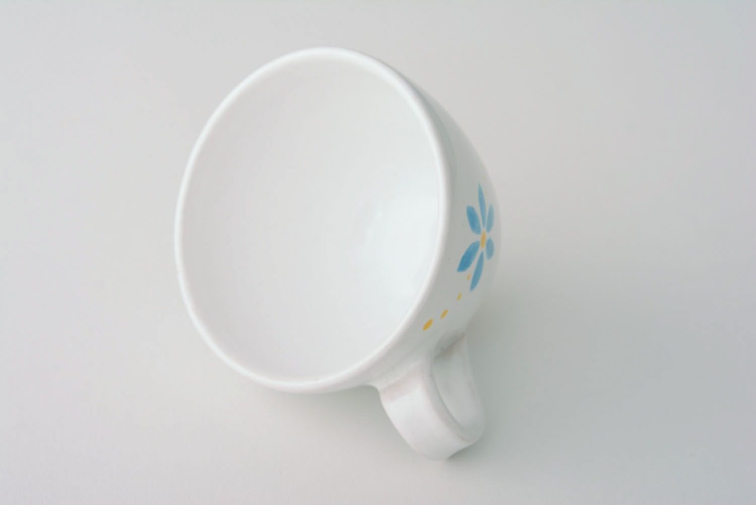 White ceramic drinking handmade 5 oz cup with handle and orange-blue flowers' pattern photo 2