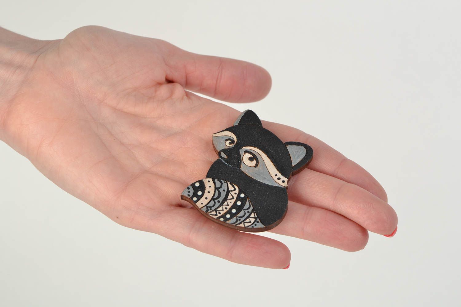 Beautiful small handmade wooden brooch in the shape of dark raccoon for children photo 2