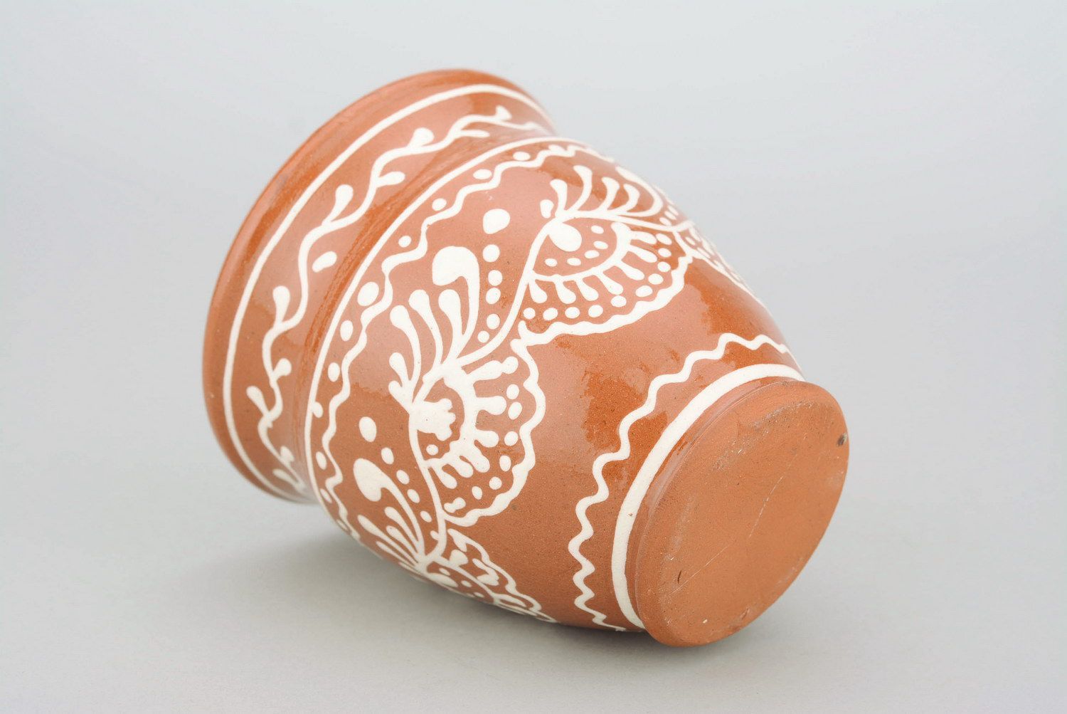 Glazed clay tea cup in terracotta color with eco pattern in white color photo 3