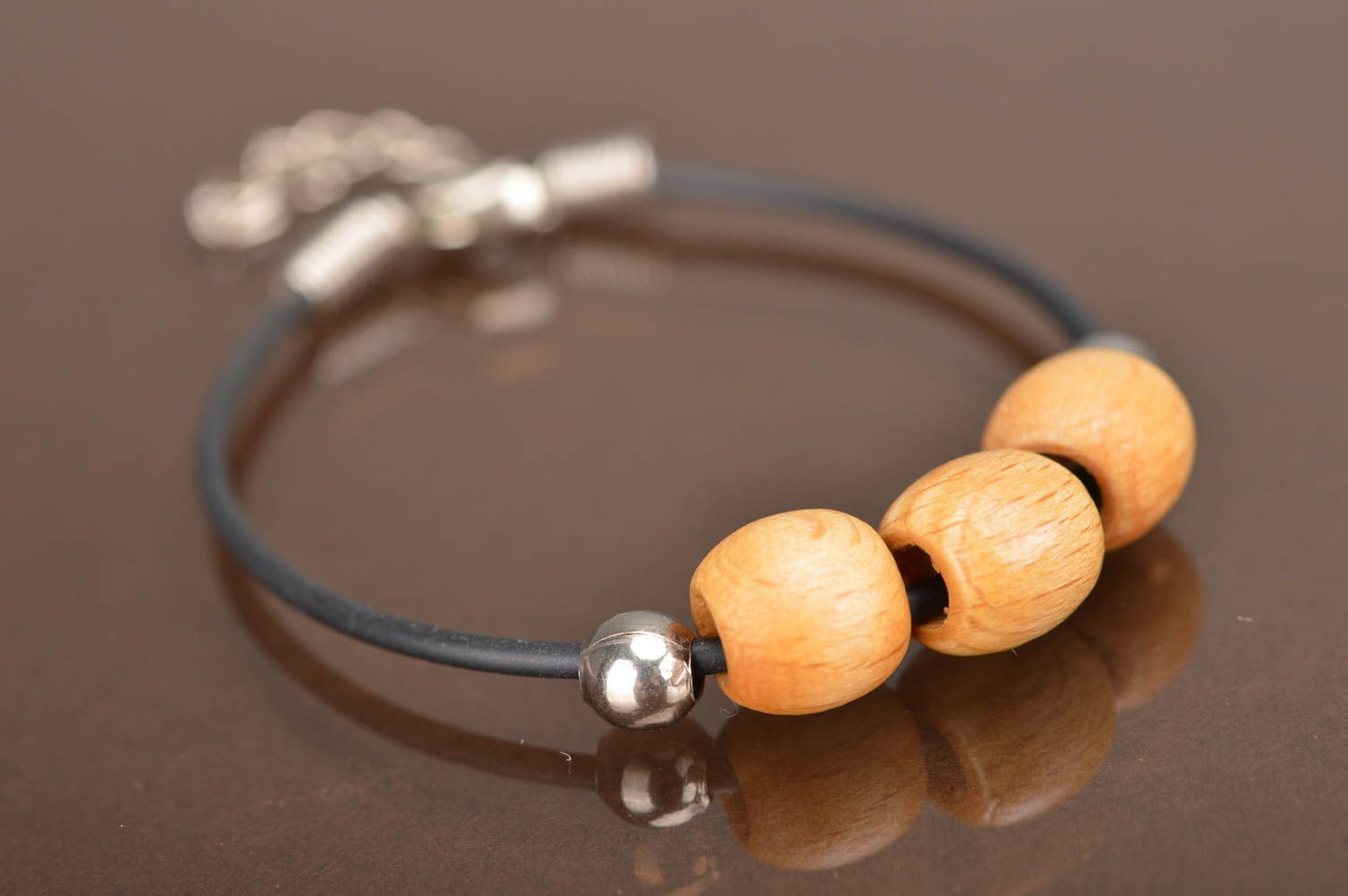 Handmade laconic simple rubber cord wrist bracelet with light wooden beads photo 2