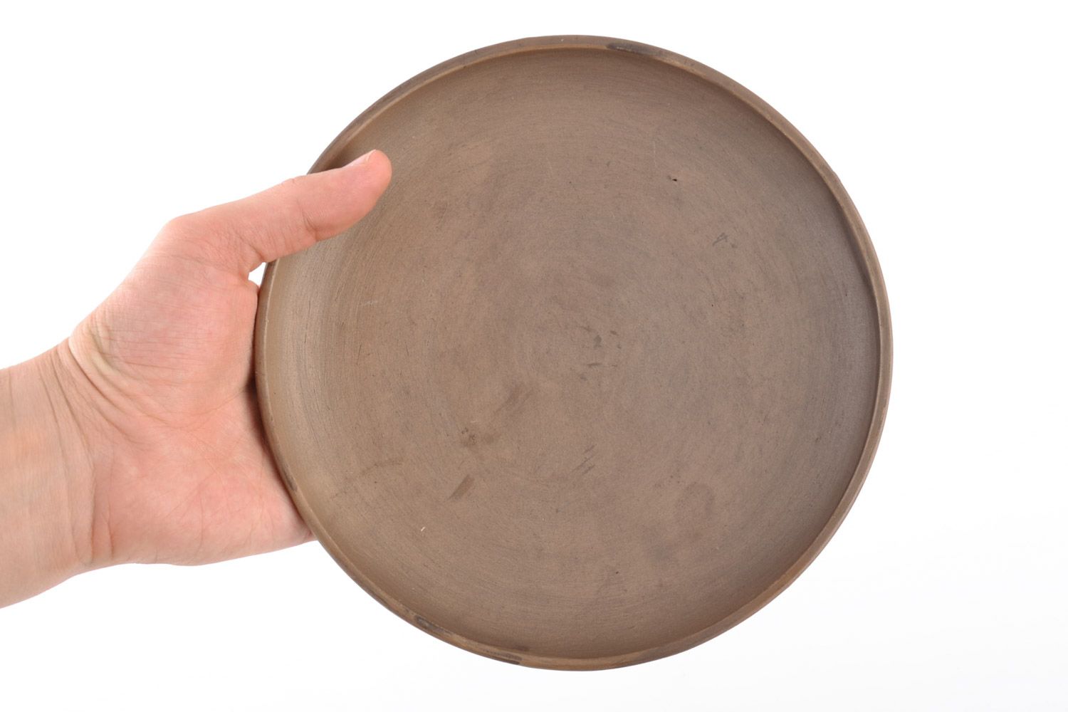 Handmade flat round ceramic plate of brown color kilned with milk for kitchen photo 2