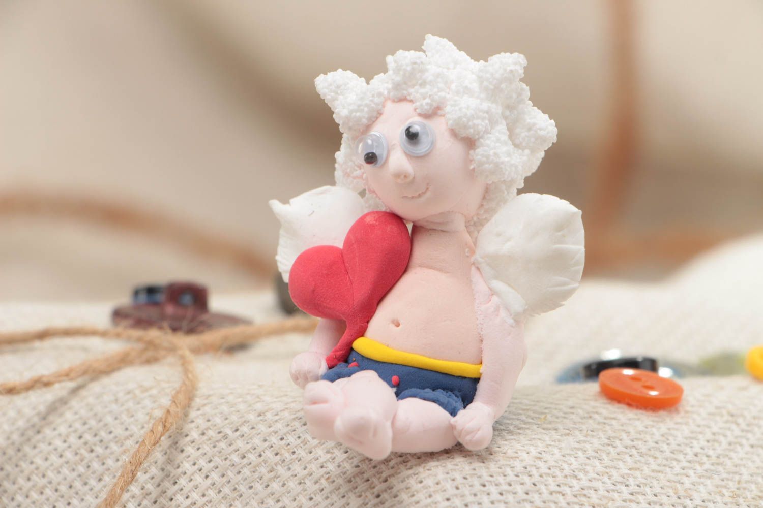 Beautiful funny handmade plastic interior statuette of angel with heart photo 1