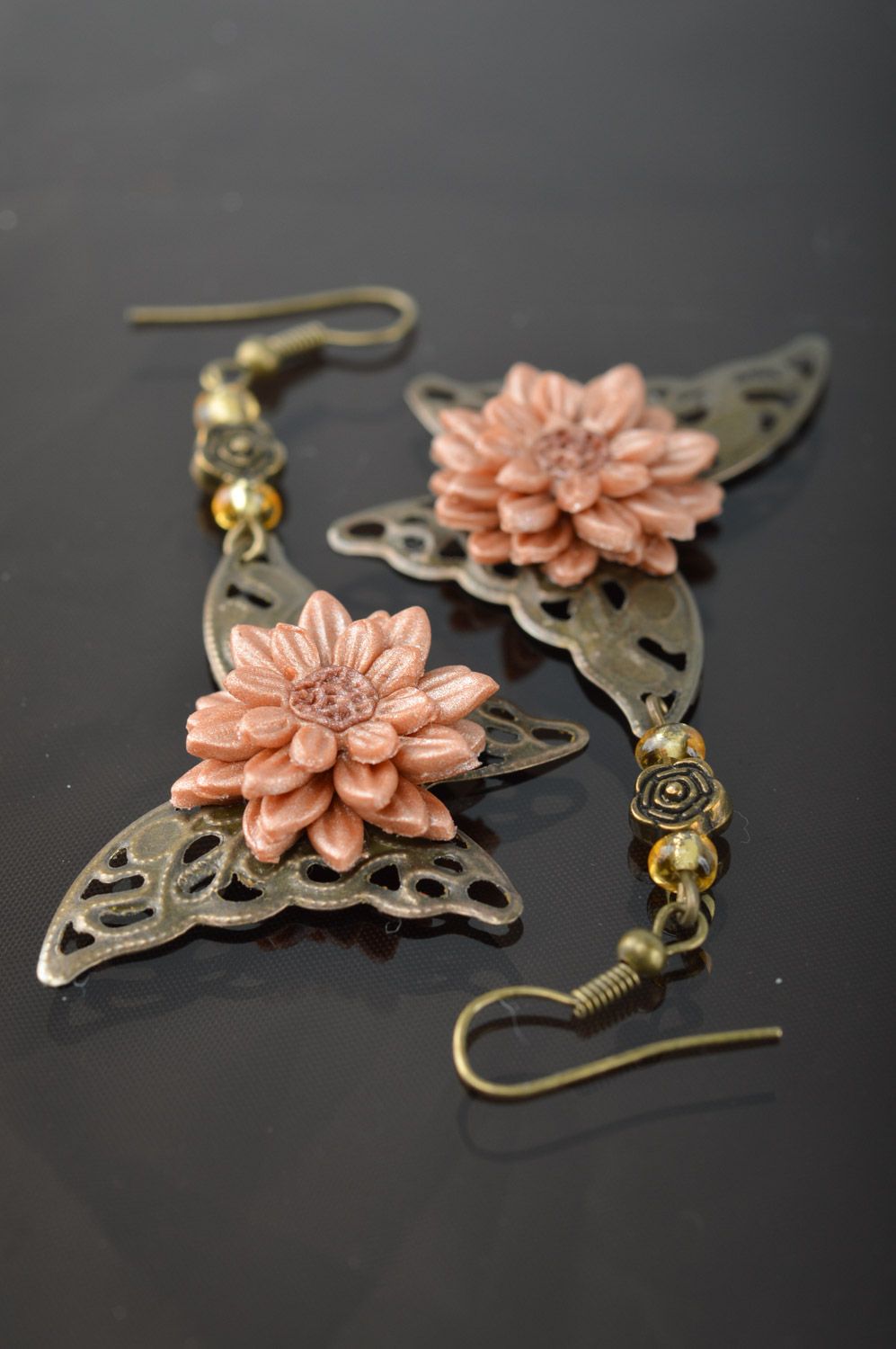Dangle earrings hand made of metal and polymer clay in the shape of butterflies and flowers photo 1