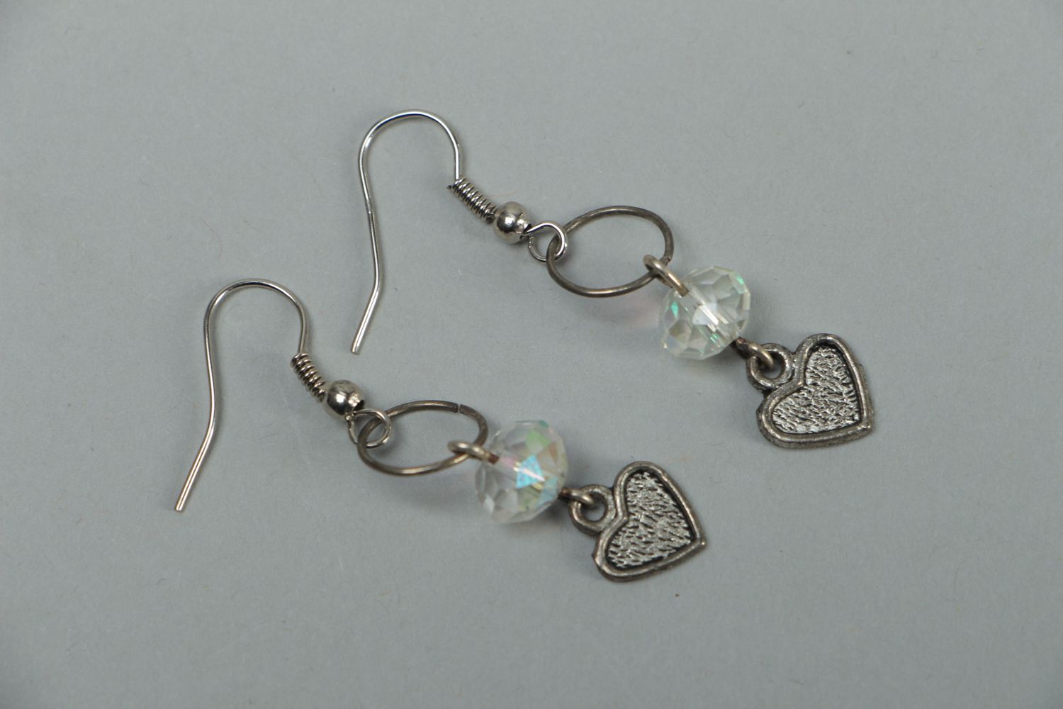 Metal earrings with heart beads photo 1