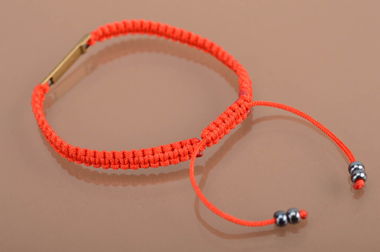 Handmade beautiful red bracelet made of silk threads with metal insert photo 4