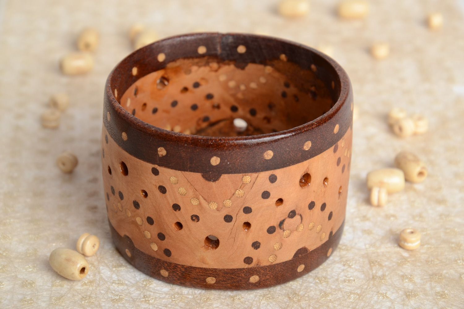 Handmade two-colored wide wooden wrist bracelet with inlay and perforation  photo 1