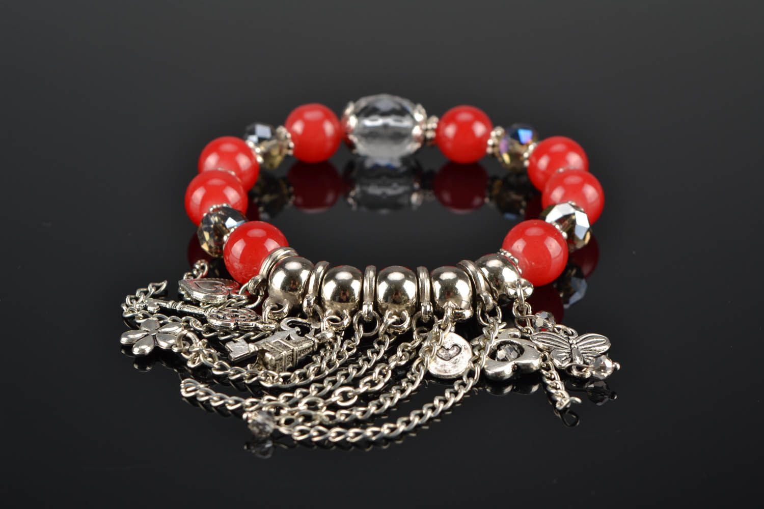 Red bracelet with charms photo 2