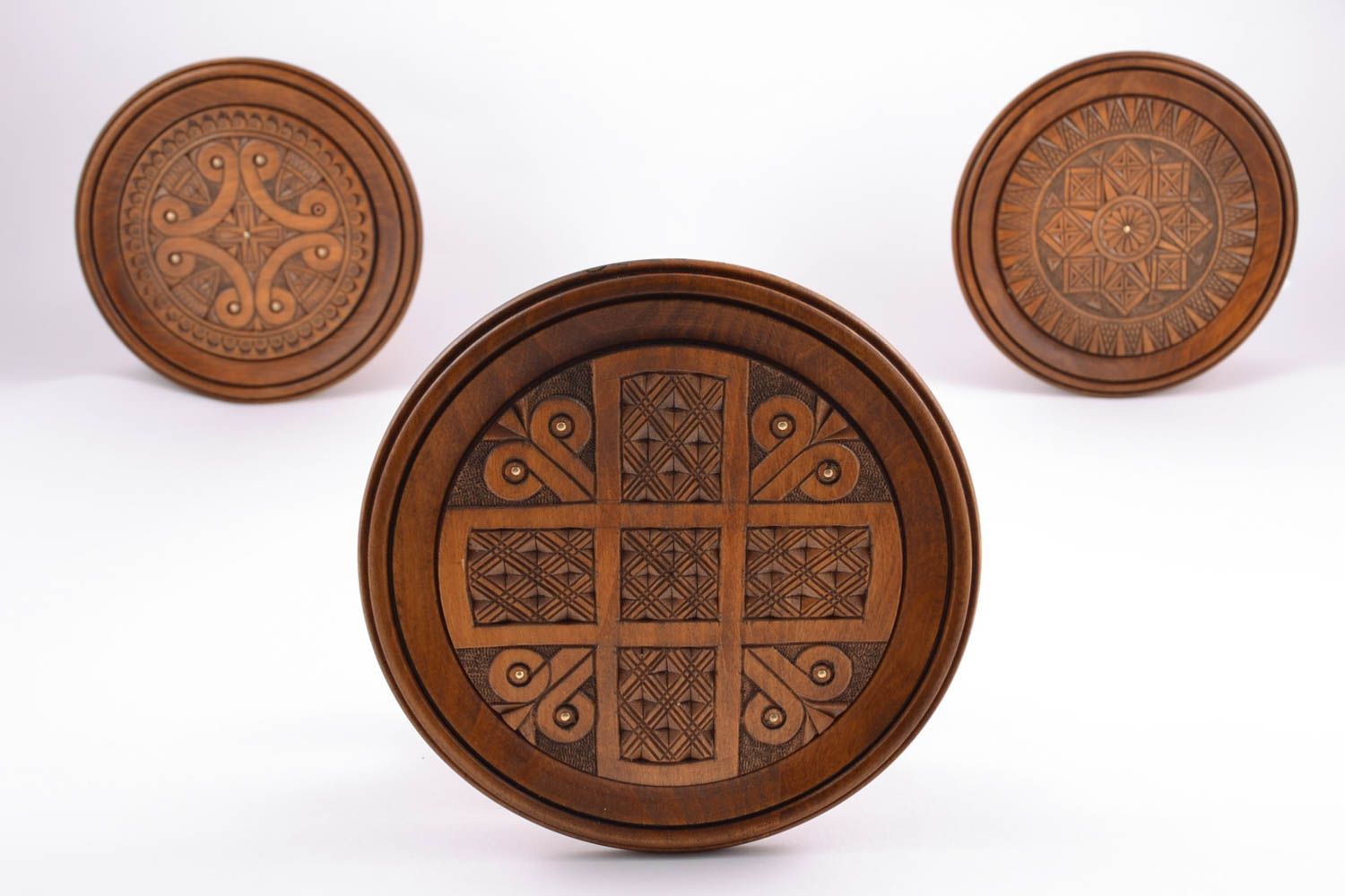 Wooden plate with inlay and carving photo 1