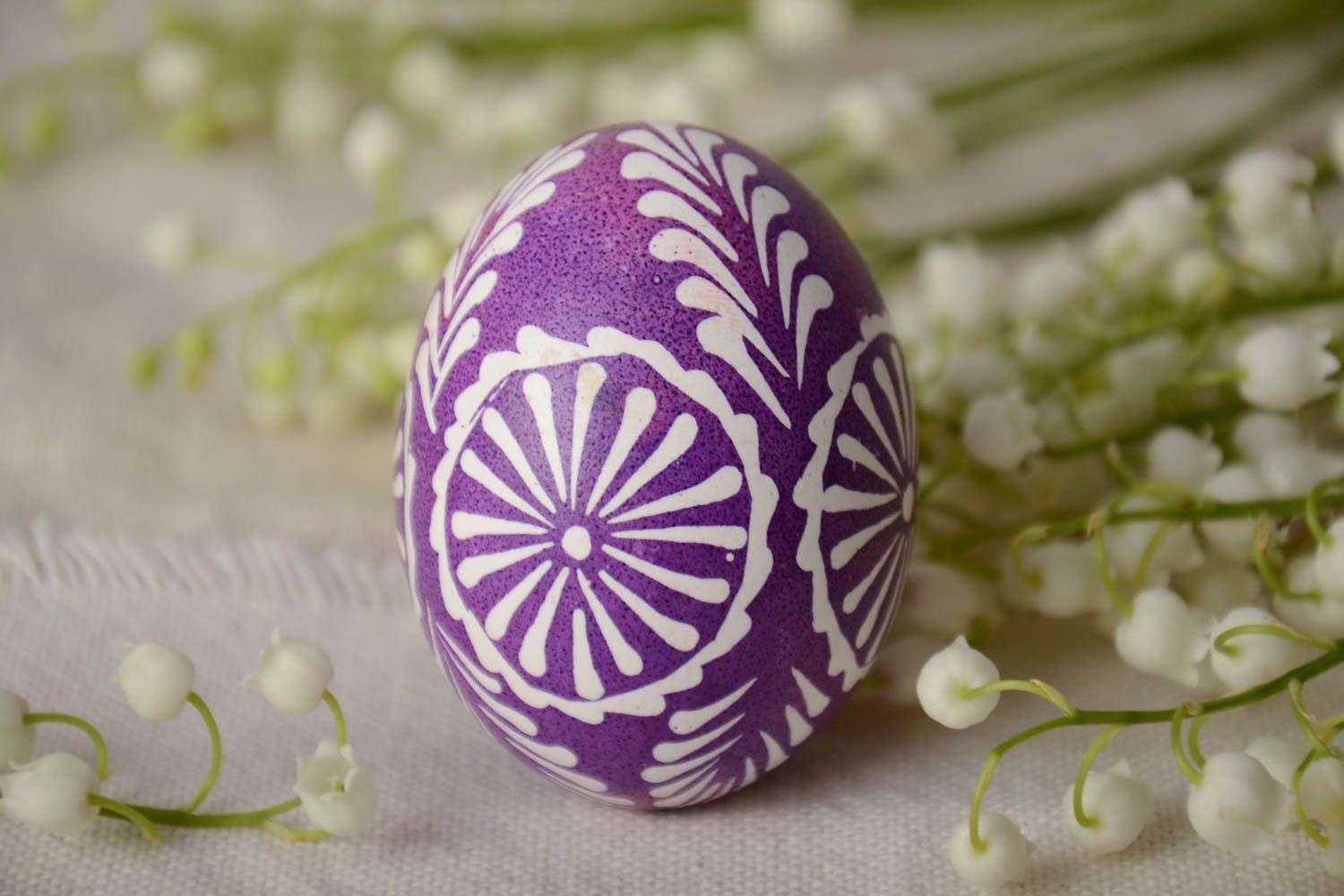 Handmade decorative violet and white Easter egg painted in Lemkiv style photo 1