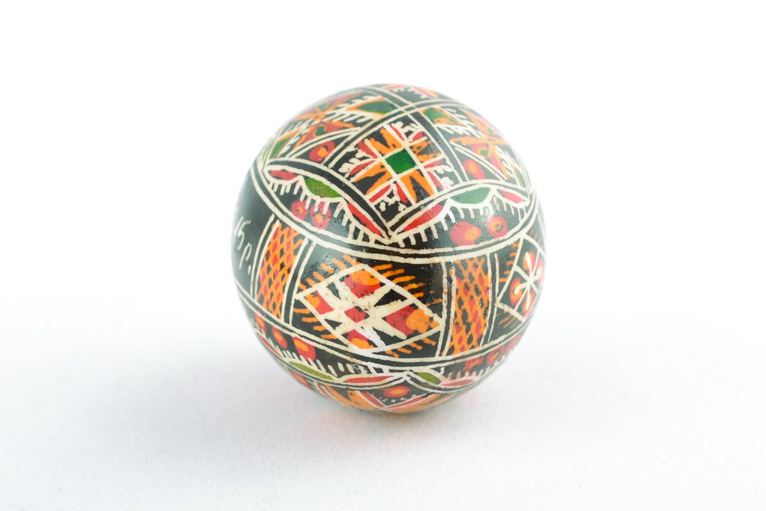 Beautiful handmade chicken egg painted with geometric ornament using wax technique  photo 4