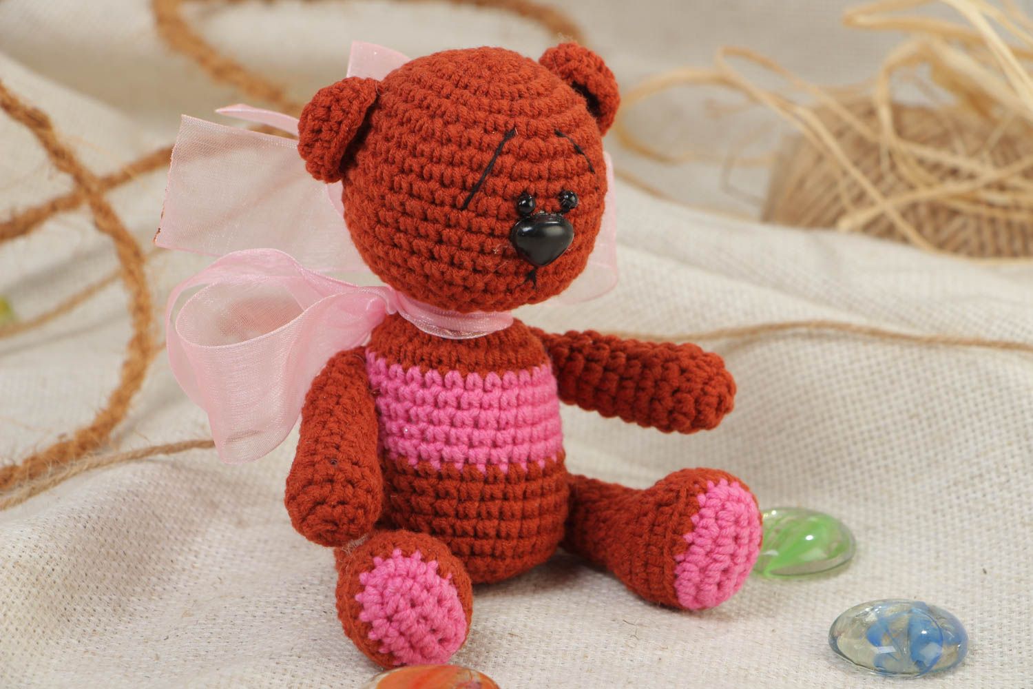 Handmade soft toy crocheted of acrylic threads brown bear with big pink bow photo 1