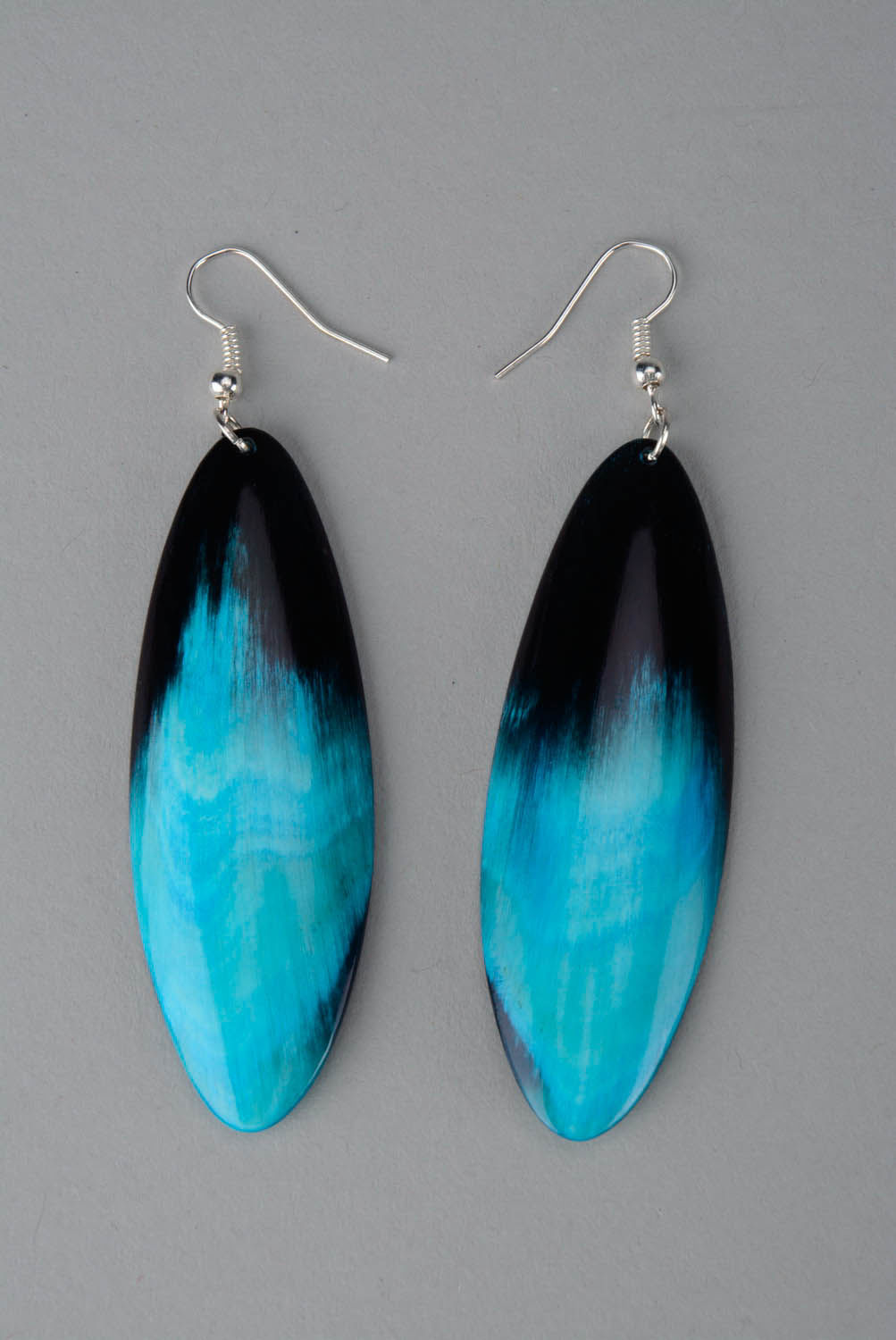 Long earrings made of polished horn photo 3
