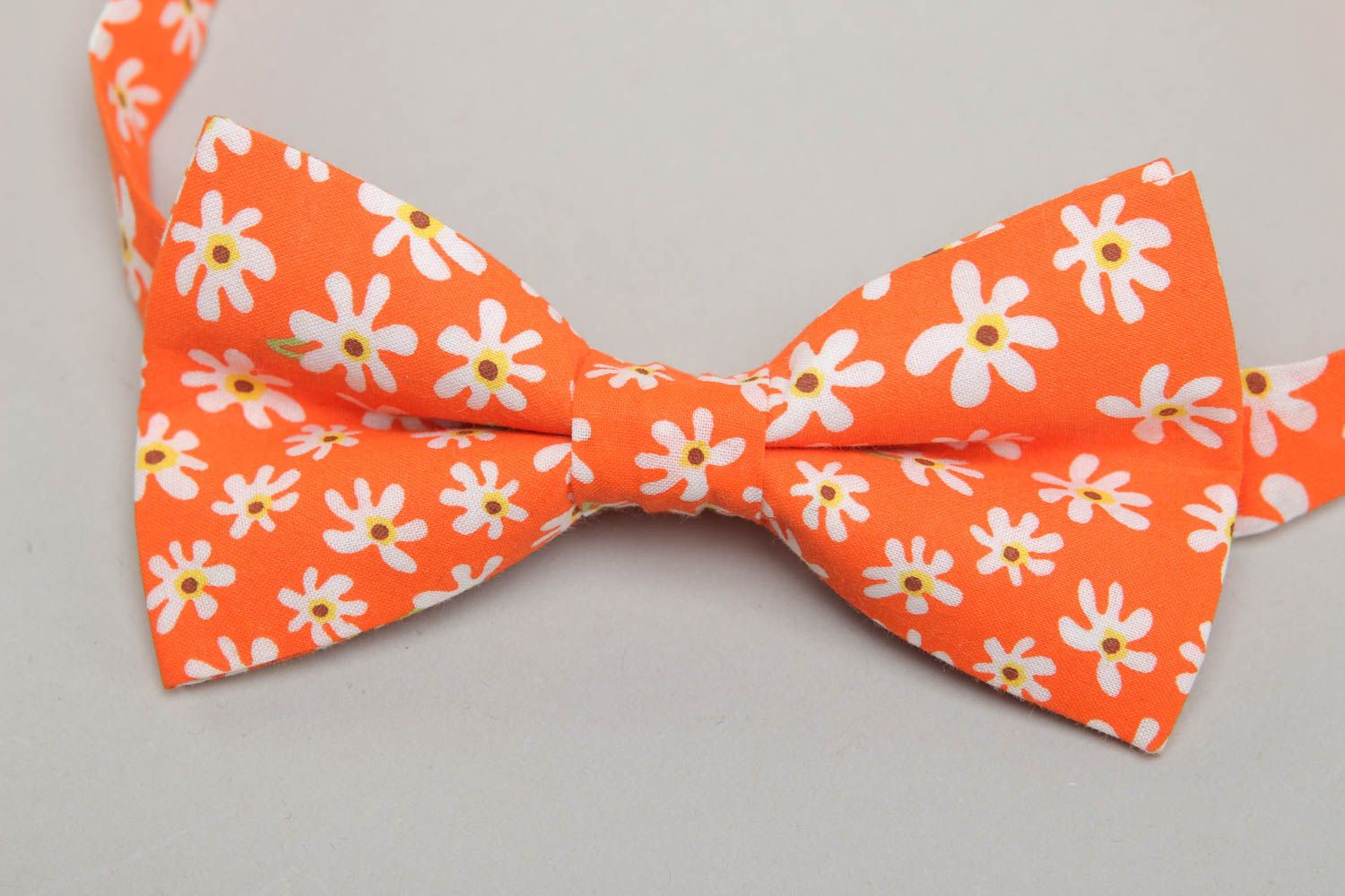 Orange fabric bow tie with floral pattern photo 2