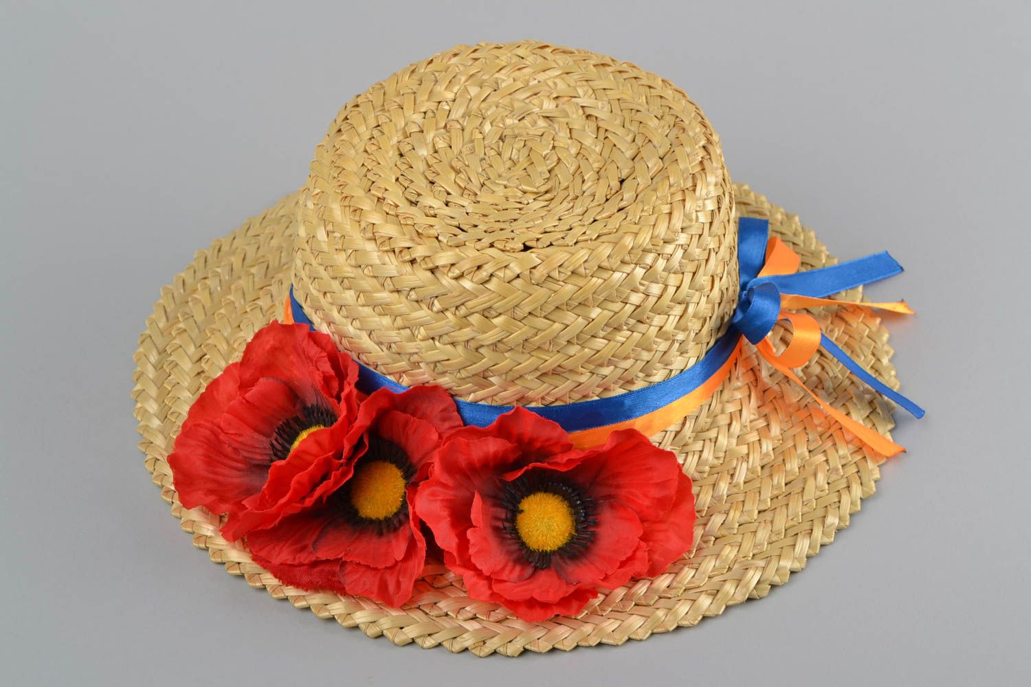 Handmade designer summer straw hat with artificial red flowers and ribbons photo 2