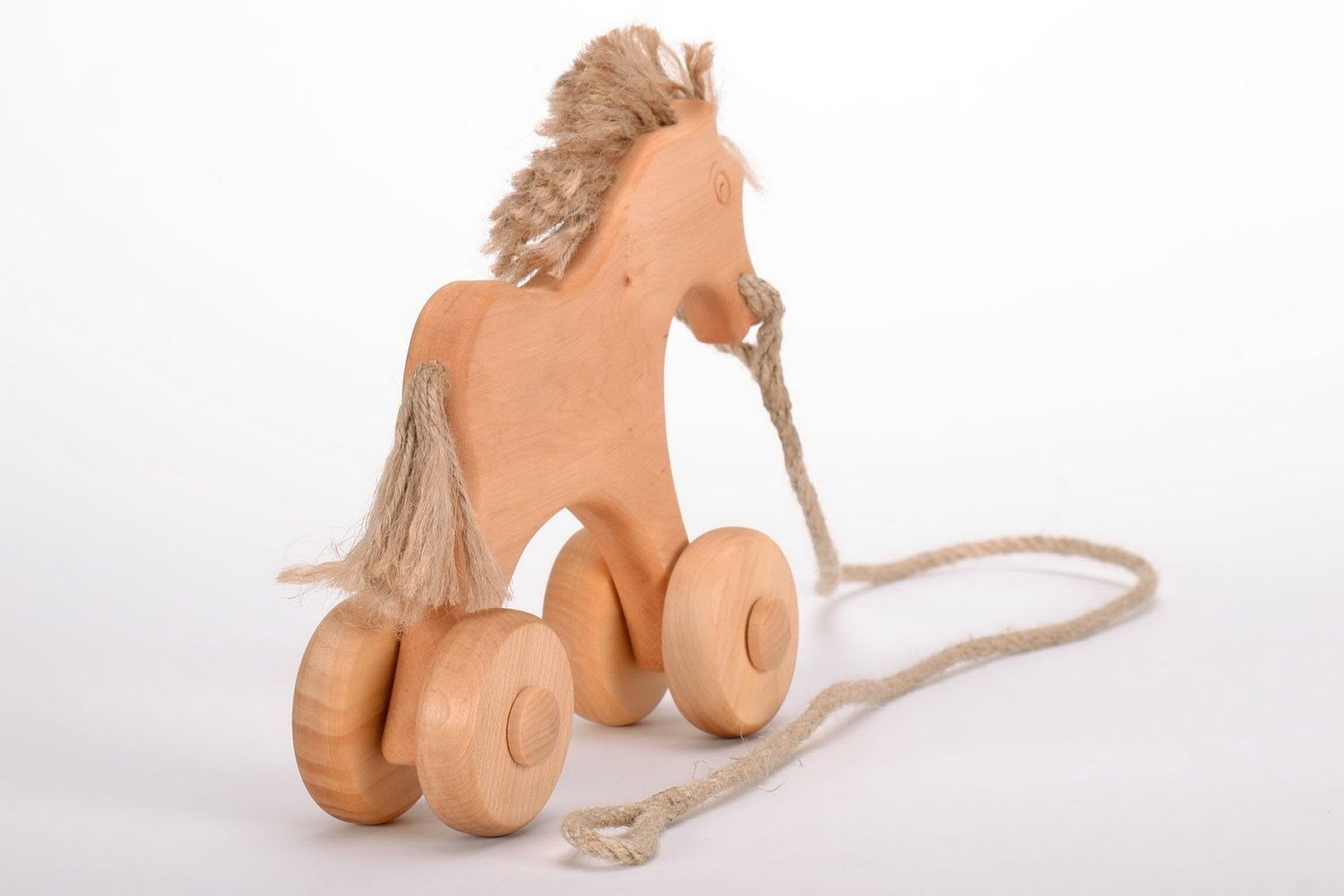 Holzspielzeug Pferd mit Rädern foto 4