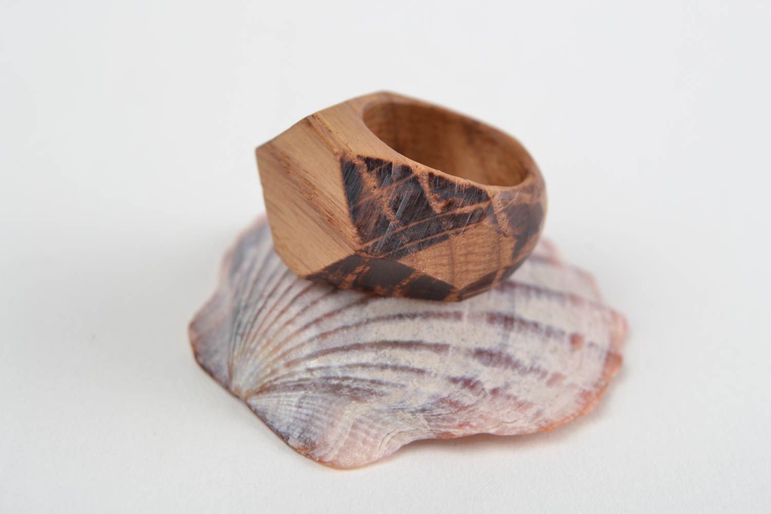 Handmade stylish designer jewelry ring cut out of natural oak wood with facets photo 1