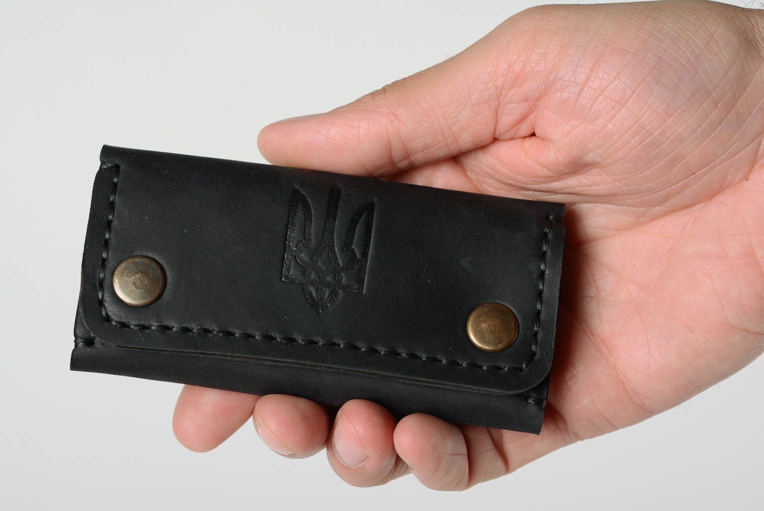 Handmade black genuine leather key case with embossed coat of arms of Ukraine photo 1