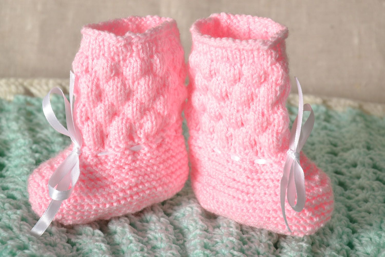 Pink knitted baby booties photo 1