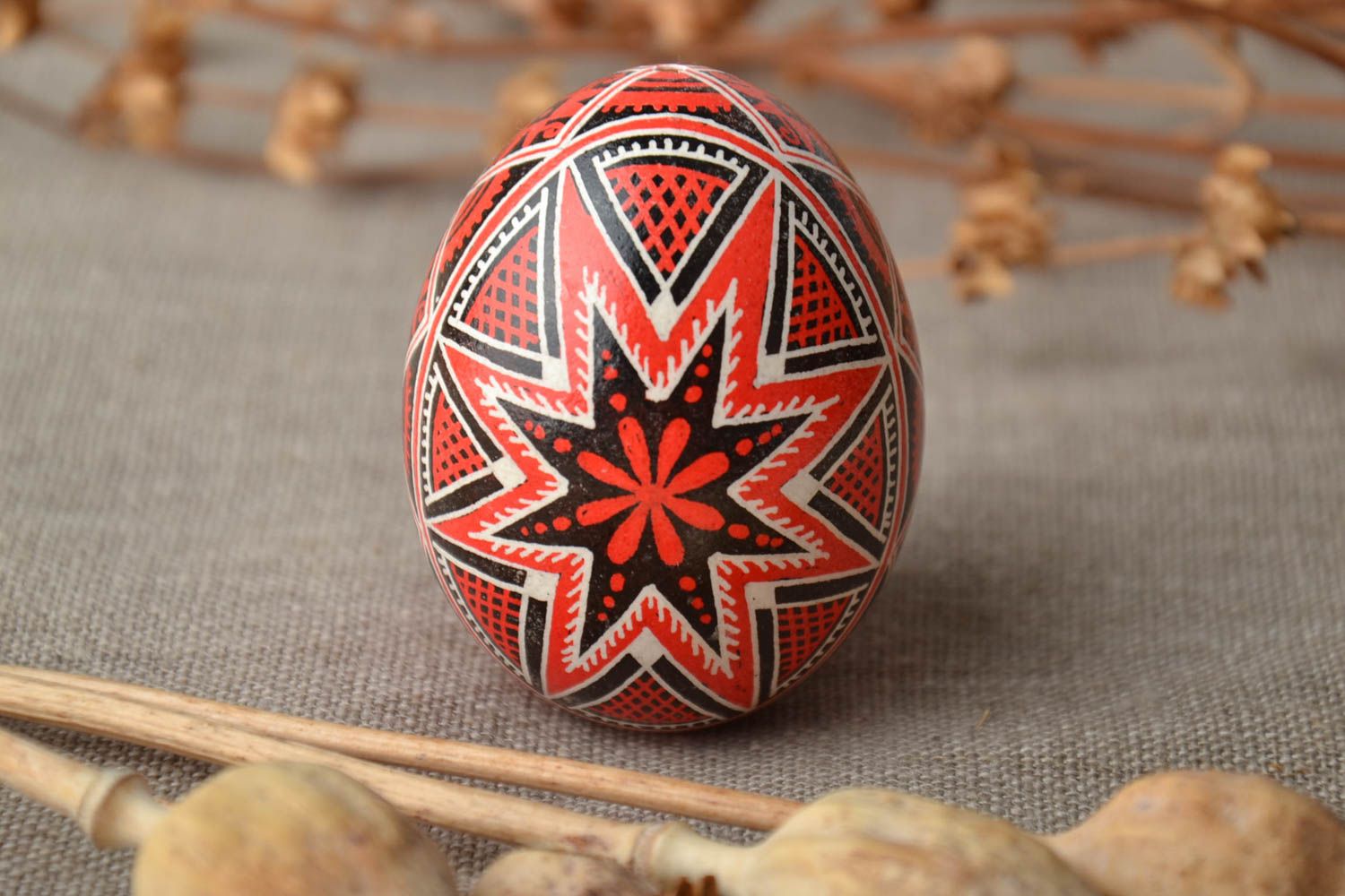 Handmade Easter egg painted with red and black colors photo 1