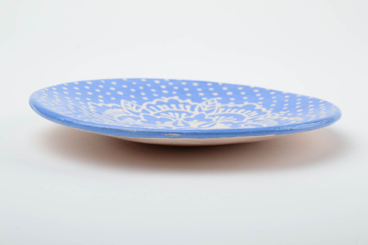 Handmade decorative small glazed ceramic saucer of blue color with white pattern photo 4