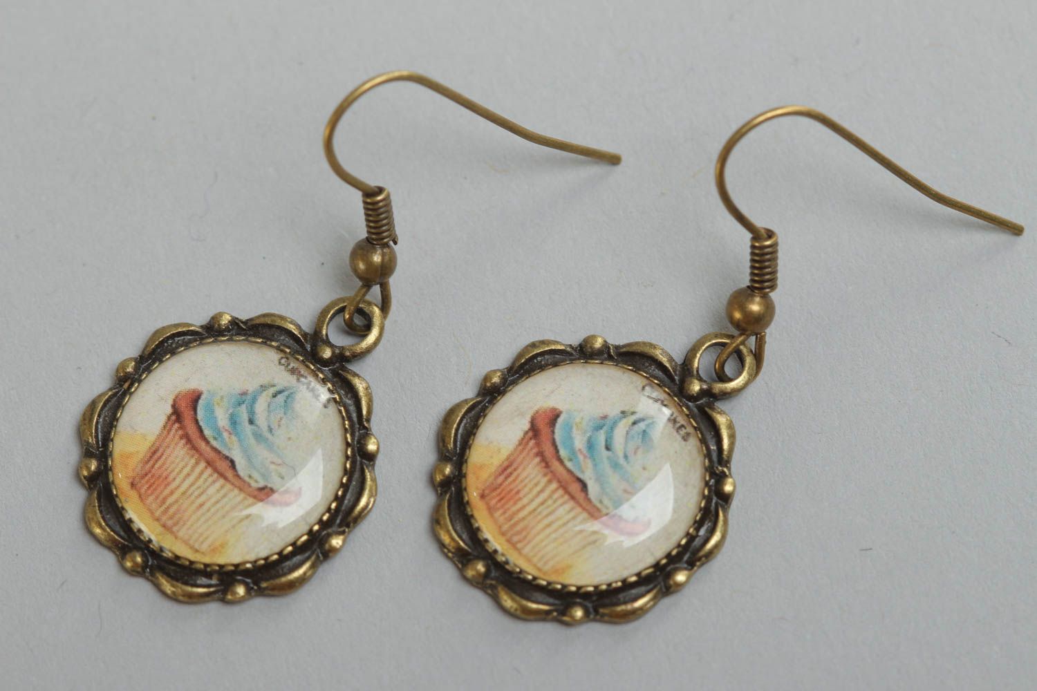 Handmade round earrings with metal basis and imagery of cakes coated with glass photo 2