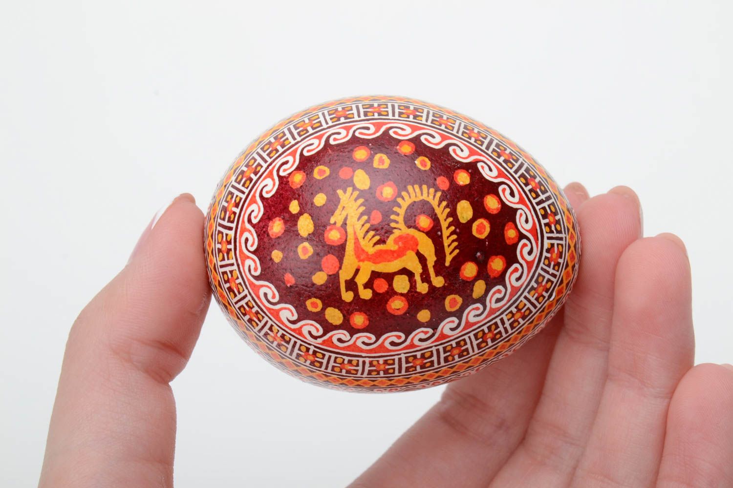 Homemade bright decorative painted Easter egg pysanka with image of horse photo 5