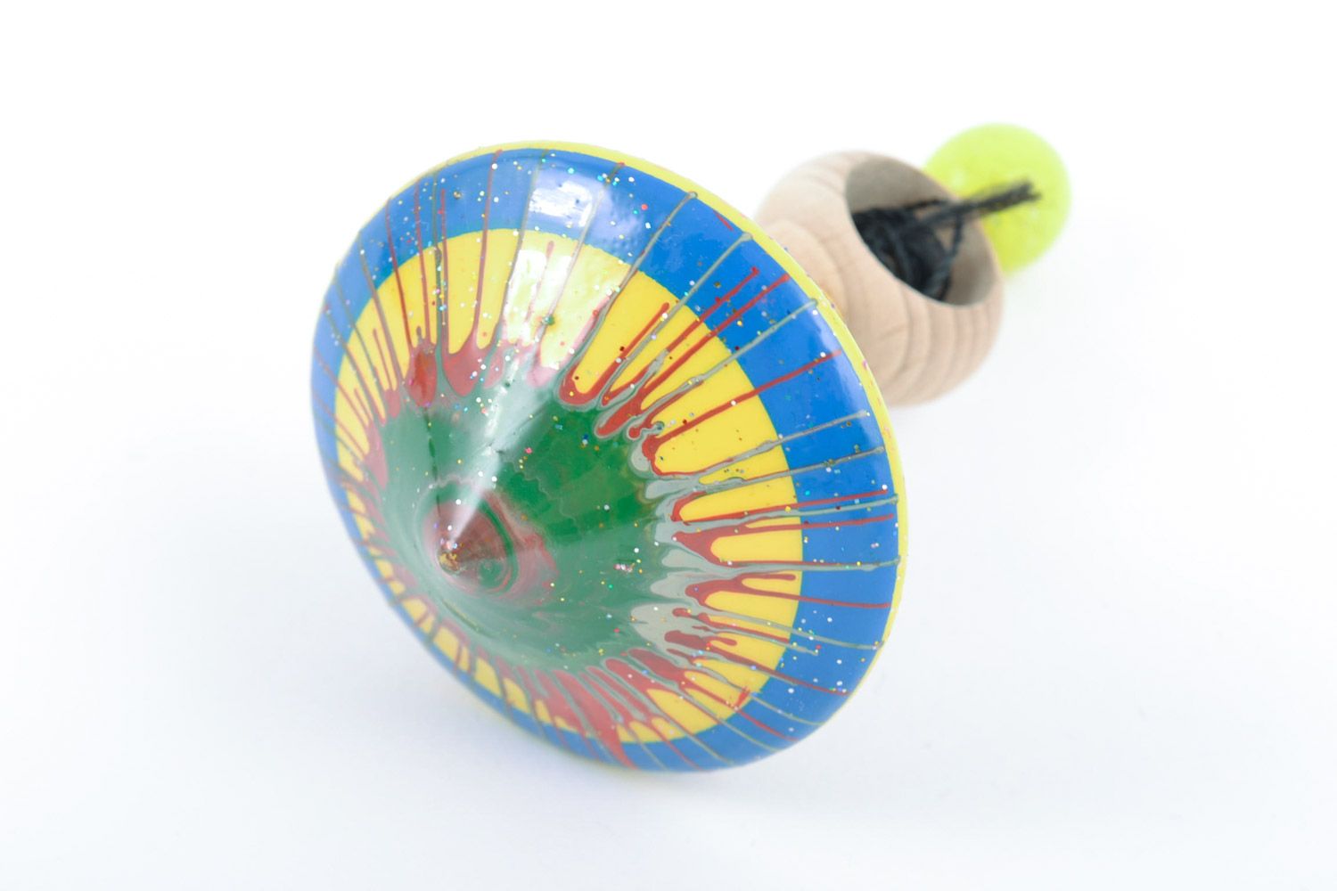 Wooden handmade beautiful spinning top decorated with eco-friendly paints manually photo 2
