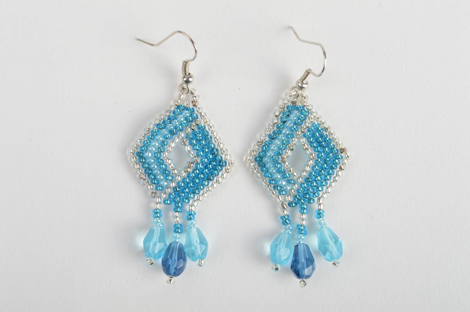 Handmade bead woven dangle earrings in the shape of rhombus of light blue color photo 2