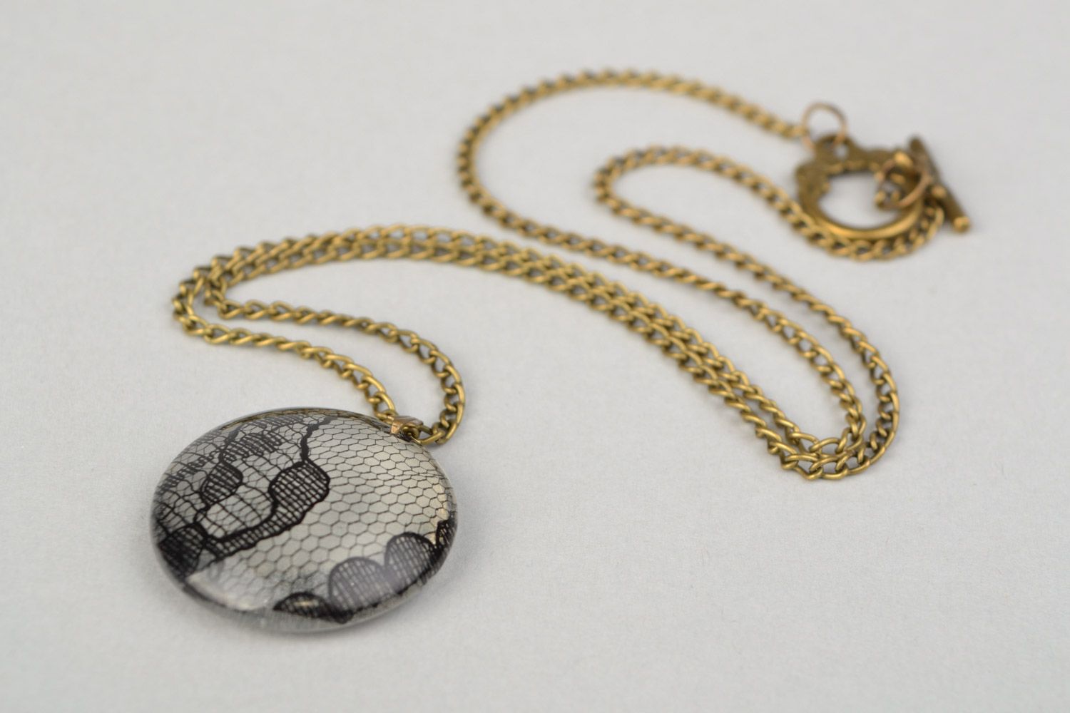 Beautiful women's round pendant on chain with epoxy coating photo 3