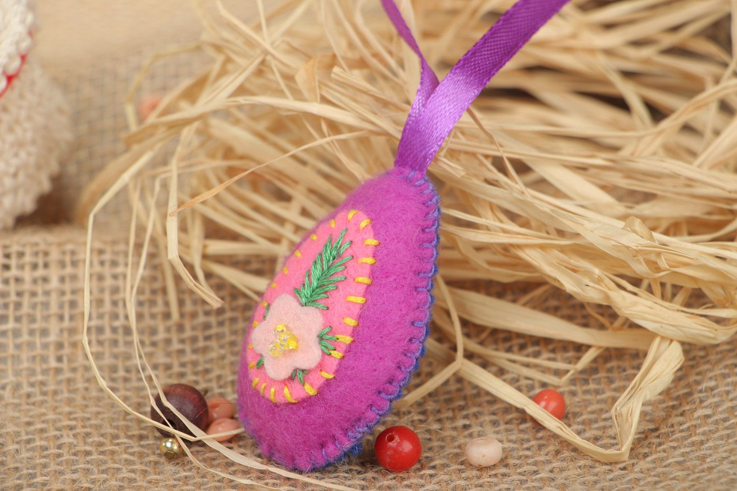 Small handmade decorative wall hanging Easter egg sewn of pink and blue felt photo 1