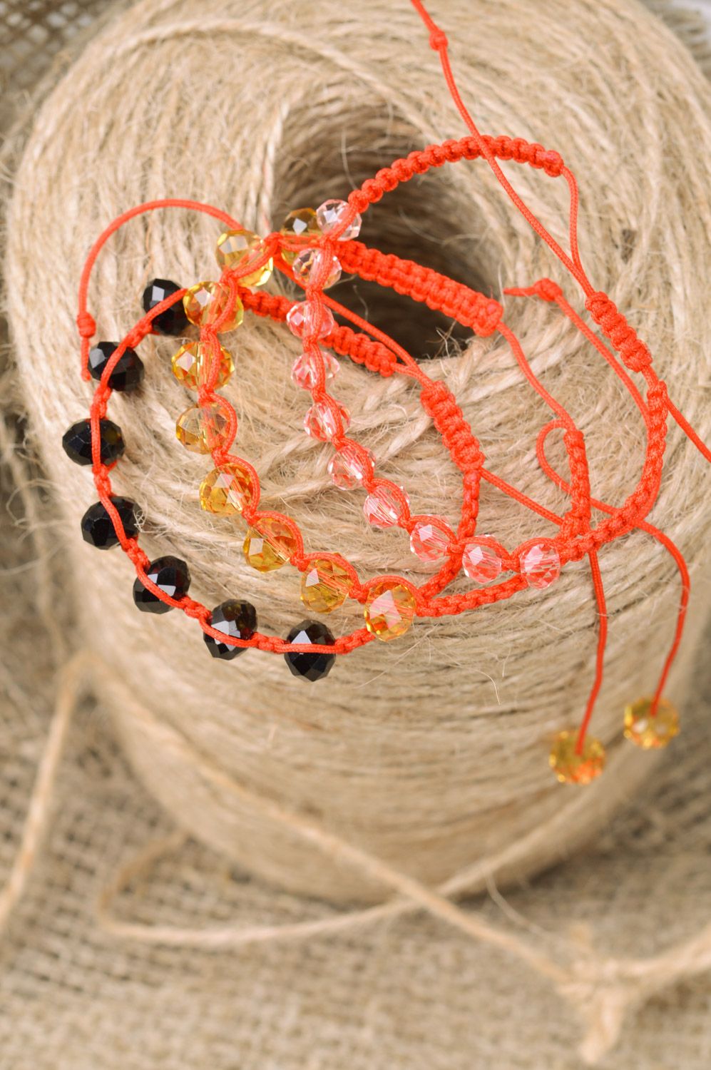 Set of stylish handmade wrist bracelets woven of beads and threads of red color 3 items photo 1