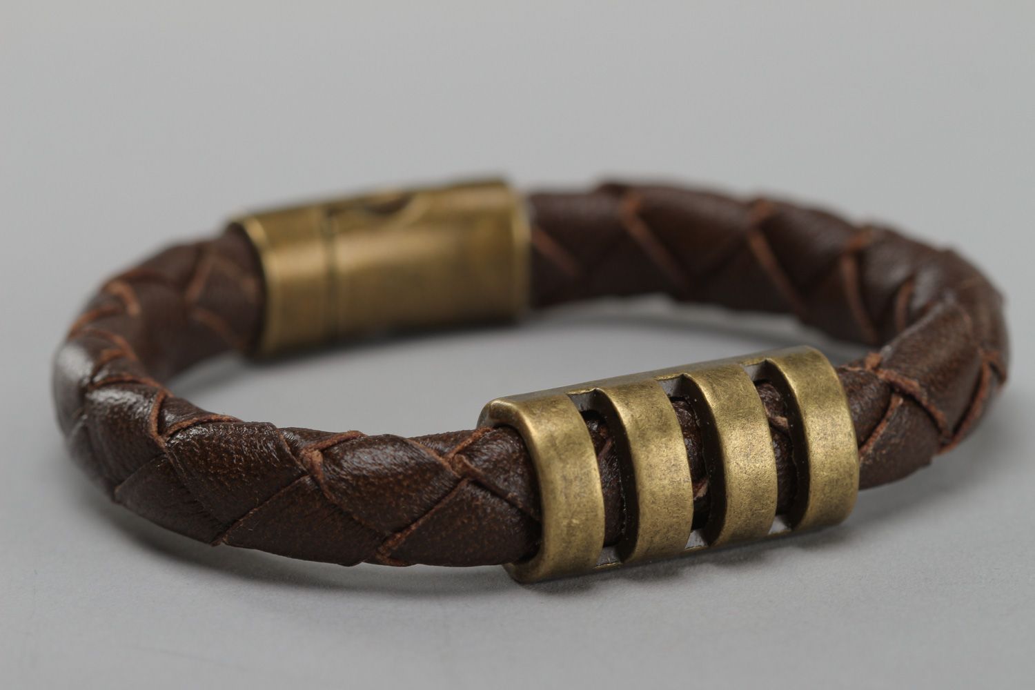 Handmade wrist bracelet woven of brown genuine leather with metal inserts photo 3