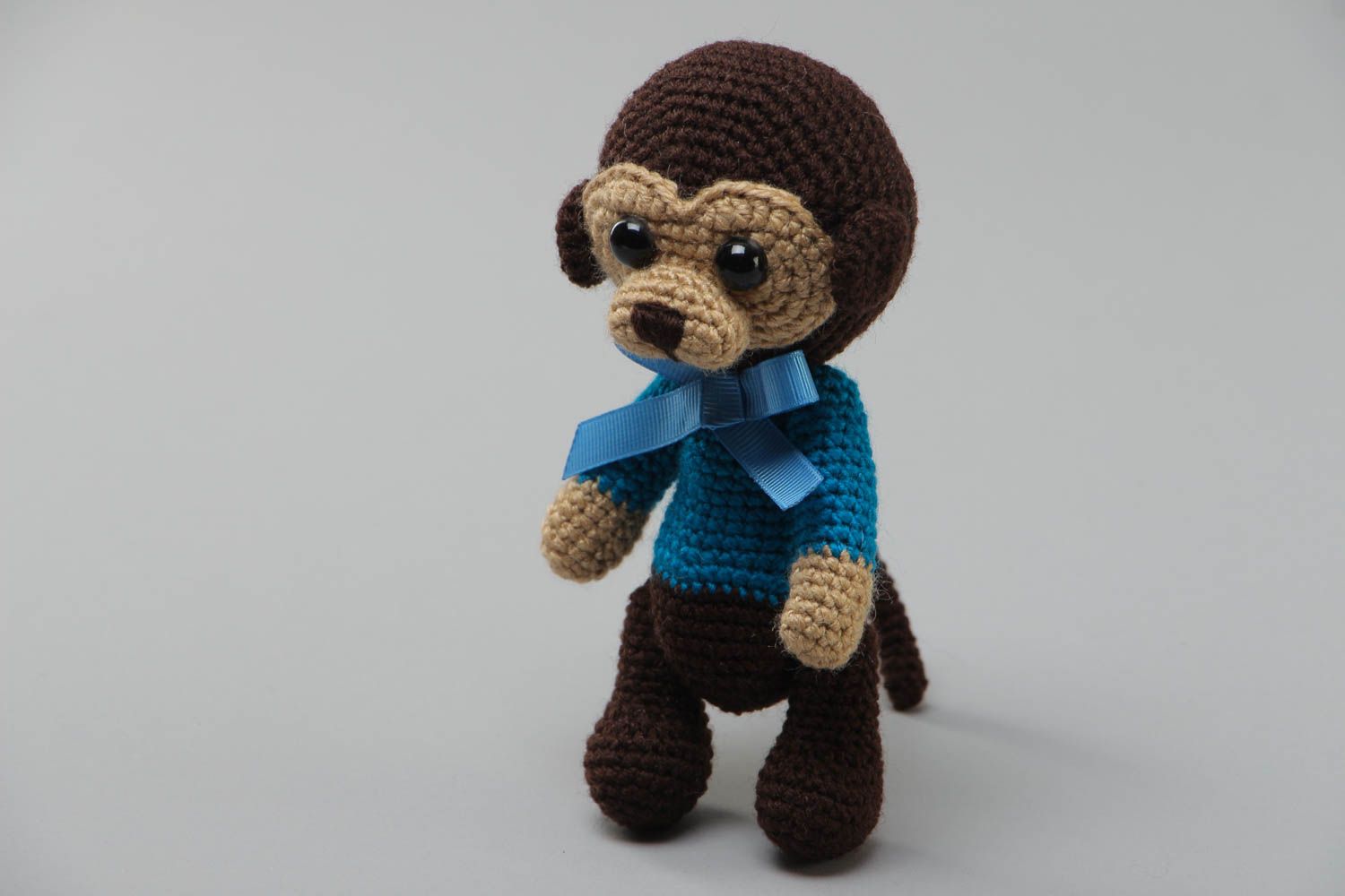 Handmade small crochet soft toy sad monkey in blue sweater with bow photo 2