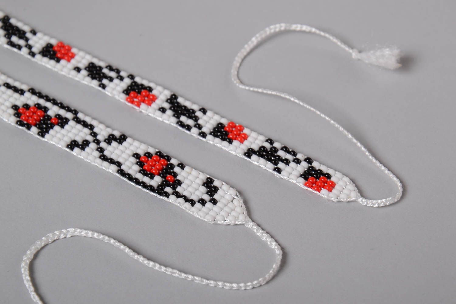 Two beaded strand bracelets on white cord with floral ornament for girls photo 4