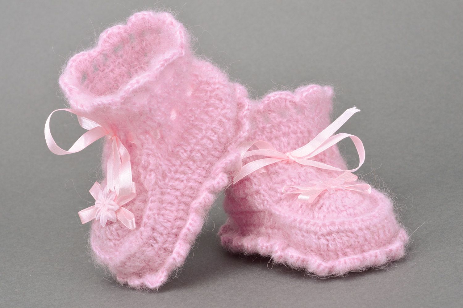 Handmade crocheted baby booties for girls made of angora in pink color with bows photo 2