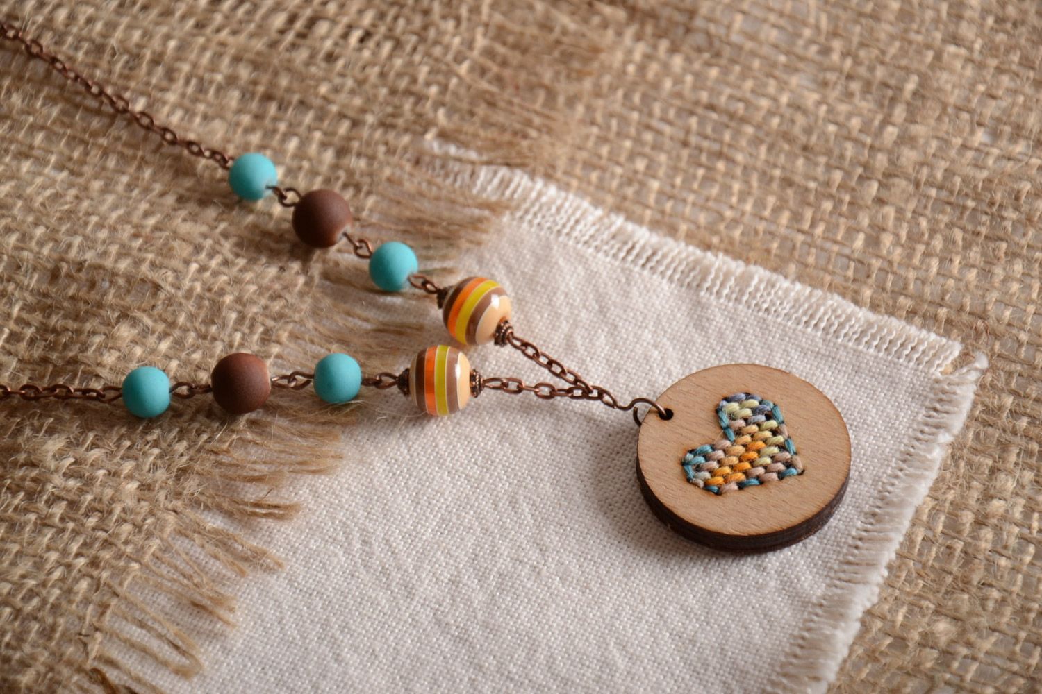 Handmade plywood pendant on a long chain with embroidery and beads for women photo 1