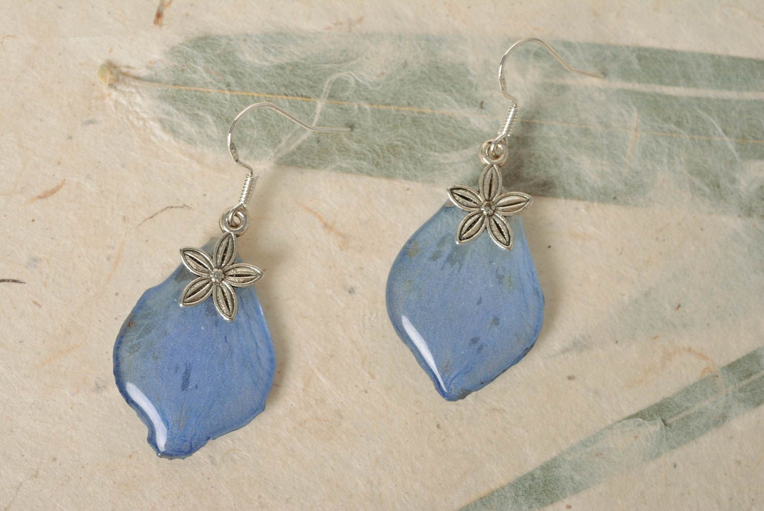 Beautiful homemade blue earrings with dried flowers coated with epoxy photo 1