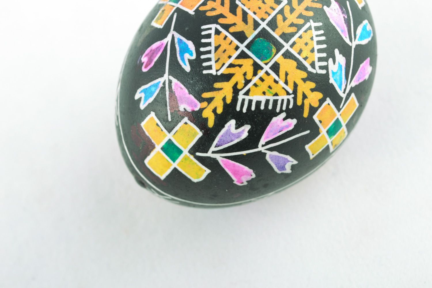 Handmade ornamented Easter egg painted using waxing technique photo 4