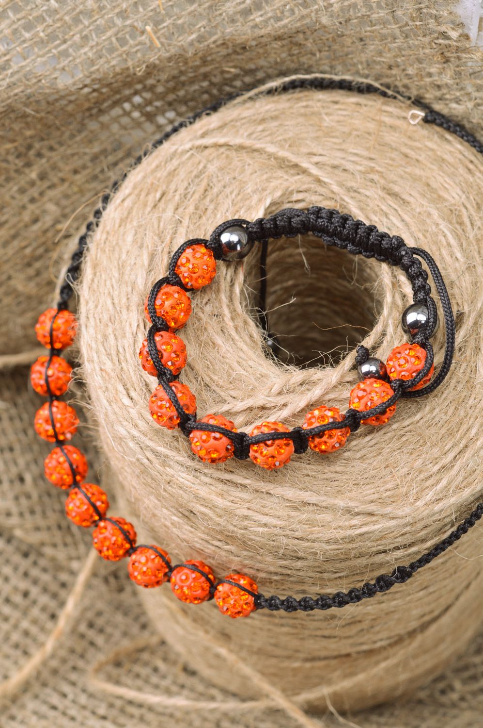 Set of jewelry woven of threads and orange beads necklace and friendship bracelet photo 1
