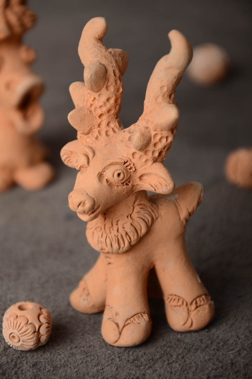 Handmade small unpainted ceramic figurine of deer for interior decoration photo 1